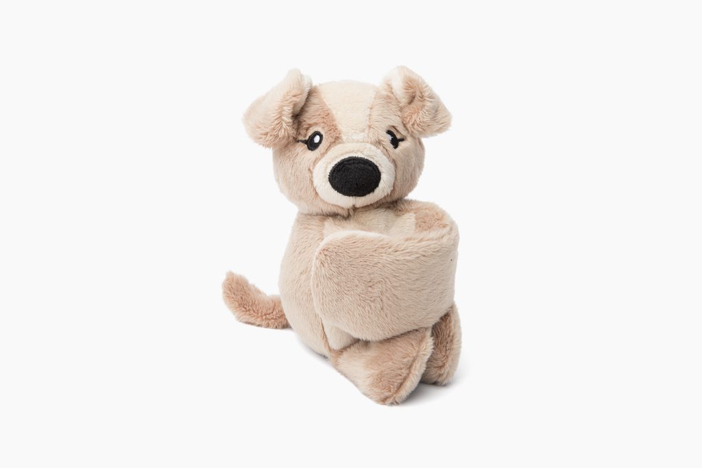 This photo shows a Puppy Hug Baby, bracelet arms curled in, on a white background