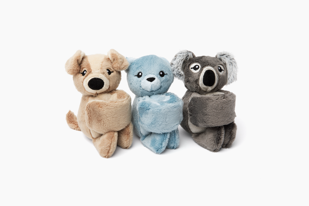 This photo shows three Hug Babies sitting with their arms curled up, on a white background: Puppy, Cat, Koala